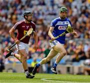 30 June 2019; Aaron Dunphy of Laois runs past Paul Greville of Westmeath on his way to scoring the second goal, in the 18th minute, of the Joe McDonagh Cup Final match between Laois and Westmeath at Croke Park in Dublin. Photo by Ray McManus/Sportsfile