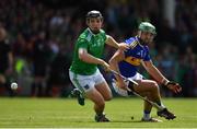 30 June 2019; Peter Casey of Limerick in action against James Barry of Tipperary during the Munster GAA Hurling Senior Championship Final match between Limerick and Tipperary at LIT Gaelic Grounds in Limerick. Photo by Brendan Moran/Sportsfile