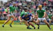 30 June 2019; James Barry of Tipperary is tackled by Peter Casey and Tom Morrissey of Limerick during the Munster GAA Hurling Senior Championship Final match between Limerick and Tipperary at LIT Gaelic Grounds in Limerick. Photo by Brendan Moran/Sportsfile