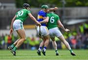 30 June 2019; John O'Dwyer of Tipperary is tackled by Gearóid Hegarty, left, and Declan Hannon of Limerick during the Munster GAA Hurling Senior Championship Final match between Limerick and Tipperary at LIT Gaelic Grounds in Limerick. Photo by Piaras Ó Mídheach/Sportsfile