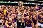 30 June 2019; Players from the winning Wexford minor and senior teams and their cup after the Leinster GAA Hurling Senior Championship Final match between Kilkenny and Wexford at Croke Park in Dublin. Photo by Ray McManus/Sportsfile