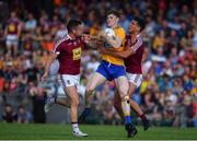 29 June 2019; Sean O'Donoghue of Clare in action against Noel Mulligan, left, and Denis Corroon of Westmeath during the GAA Football All-Ireland Senior Championship Round 3 match between Westmeath and Clare at TEG Cusack Park in Mullingar, Westmeath. Photo by Sam Barnes/Sportsfile