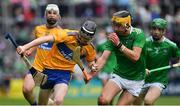 30 June 2019; Sean Ronan of Clare in action against Colin Coughlan of Limerick during the Electric Ireland Munster GAA Hurling Minor Championship Final match between Limerick and Clare at LIT Gaelic Grounds in Limerick. Photo by Brendan Moran/Sportsfile
