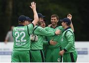 4 July 2019; Tim Murtagh of Ireland, centre, is congratulated by team-mates after taking a wicket during the 2nd One Day International Men's Cricket match between Ireland and Zimbabwe at Stormont in Belfast. Photo by Oliver McVeigh/Sportsfile