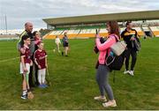 4 July 2019; Tina Ruane from Oranmore, Co. Galway takes a picture of her kids Stephen, age 10, Sarah, age 8, and Anna, age 12, with Kilkenny manager DJ Carey after the Bord Gais Energy Leinster GAA Hurling U20 Championship semi-final match between Galway and Kilkenny at Bord na Mona O'Connor Park in Tullamore, Offaly. Photo by Matt Browne/Sportsfile