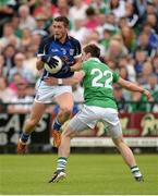 16 June 2013; David Givney, Cavan, in action against Eoin Donnelly, Fermanagh. Ulster GAA Football Senior Championship Quarter-Final, Cavan v Fermanagh, Brewster Park, Enniskillen, Co. Fermanagh. Picture credit: Oliver McVeigh / SPORTSFILE