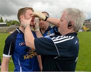 16 June 2013; Rory Dunne, Cavan, receiving treatment for a broken nose from Dr. Philip Carolan, Cavan Doctor, right, and Simon Gaffney, Cavan Physiotherapist, after the game. Ulster GAA Football Senior Championship Quarter-Final, Cavan v Fermanagh, Brewster Park, Enniskillen, Co. Fermanagh. Picture credit: Oliver McVeigh / SPORTSFILE