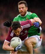 6 July 2019; Ian Burke of Galway is tackled by Chris Barrett of Mayo during the GAA Football All-Ireland Senior Championship Round 4 match between Galway and Mayo at the LIT Gaelic Grounds in Limerick. Photo by Brendan Moran/Sportsfile