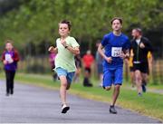 13 July 2019; Joe Kenny, aged 11, from Wicklow Town who won the family fun run from second place 14 year old Ivan Kiely from Waterford before the Irish Runner 10 Mile in conjunction with the AAI National 10 Mile Championships at Phoenix Park in Dublin. Photo by Matt Browne/Sportsfile