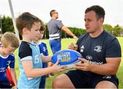24 July 2019; Leinster's Bryan Byrne signs a participant's rugby ball during the Bank of Ireland Leinster Rugby Summer Camp in St Marys College RFC in Templeogue, Dublin. Photo by Seb Daly/Sportsfile