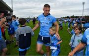 4 August 2019; Eoghan O'Gara of Dublin leaves the pitch with his daughter Ella after the GAA Football All-Ireland Senior Championship Quarter-Final Group 2 Phase 3 match between Tyrone and Dublin at Healy Park in Omagh, Tyrone. Photo by Brendan Moran/Sportsfile
