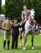 7 August 2019; Sean Looney from Co Waterford United on Stormy Diamond Lady is presented with the Performance Irish Draught over-all champion trophy by judges Julian White from England, left, and John Keen from Wales at the Stena Line Dublin Horse Show 2019 at the RDS in Dublin. Photo by Matt Browne/Sportsfile