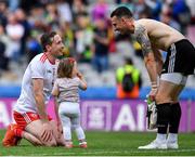 11 August 2019; Colm Cavanagh of Tyrone with his daughter Chloe and team-mate Niall Morgan after the GAA Football All-Ireland Senior Championship Semi-Final match between Kerry and Tyrone at Croke Park in Dublin. Photo by Brendan Moran/Sportsfile