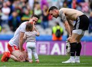 11 August 2019; Colm Cavanagh of Tyrone with his daughter Chloe and team-mate Niall Morgan after the GAA Football All-Ireland Senior Championship Semi-Final match between Kerry and Tyrone at Croke Park in Dublin. Photo by Brendan Moran/Sportsfile