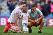 11 August 2019; Colm Cavanagh of Tyrone and his daughter Chloe with team-mate Michael McKernan after the GAA Football All-Ireland Senior Championship Semi-Final match between Kerry and Tyrone at Croke Park in Dublin. Photo by Brendan Moran/Sportsfile