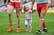 11 August 2019; Chloe Cavanagh leaves the pitch with her father Colm Cavanagh of Tyrone and his team-mate Michael McKernan after the GAA Football All-Ireland Senior Championship Semi-Final match between Kerry and Tyrone at Croke Park in Dublin. Photo by Brendan Moran/Sportsfile