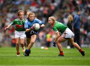 10 August 2019; Layla Stafford, Glynn NS Glynn, Wexford, representing Dublin, in action against Caoimhe Kelly, Mullaghrafferty, Carrickmacross, Monaghan, representing Mayo, and Lilly Murray, Ballymurray NS, Ballymurray, Roscommon, representing Mayo, during the INTO Cumann na mBunscol GAA Respect Exhibition Go Games during the GAA Football All-Ireland Senior Championship Semi-Final match between Dublin and Mayo at Croke Park in Dublin. Photo by Ray McManus/Sportsfile
