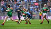 10 August 2019; Shelly Ryan, Ballyporeen NS, Cahir, Tipperary, representing Mayo, in action against Ellie McCarthy, St John’s PS, Maghera, Derry, representing Dublin, during the INTO Cumann na mBunscol GAA Respect Exhibition Go Games during the GAA Football All-Ireland Senior Championship Semi-Final match between Dublin and Mayo at Croke Park in Dublin. Photo by Piaras Ó Mídheach/Sportsfile