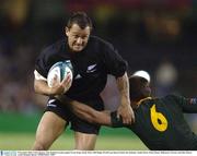 8 November 2003; Carlos Spencer, New Zealand, in action against Corne Krige, South Africa. 2003 Rugby World Cup, Quarter Final, New Zealand v South Africa, Telstra Dome, Melbourne, Victoria, Australia. Picture credit; Brendan Moran / SPORTSFILE *EDI*