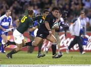 8 November 2003; Keven Mealamu, New Zealand, gets away from Jaco van der Westhuyzen, left, and Ashwin Willemse, South Africa, on the way to scoring his sides second try. 2003 Rugby World Cup, Quarter Final, New Zealand v South Africa, Telstra Dome, Melbourne, Victoria, Australia. Picture credit; Brendan Moran / SPORTSFILE *EDI*