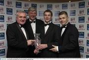 7 November 2003; An Taoiseach Bertie Ahern T.D. George Wallace, General Manager, SEAT, GPA Player of the Year JJ Delaney and GPA Chief Executive Dessie Farrell pictured at the Carphone Warehouse sponsored GPA Gala night featuring the Seat Player of Year Awards, Burlington Hotel, Dublin. Picture credit; Ray McManus / SPORTSFILE *EDI*