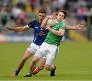 16 June 2013; Tomas Corrigan, Fermanagh, in action against Killian Clarke, Cavan. Ulster GAA Football Senior Championship Quarter-Final, Cavan v Fermanagh, Brewster Park, Enniskillen, Co. Fermanagh. Picture credit: Oliver McVeigh / SPORTSFILE