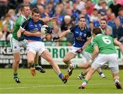 16 June 2013; David Givney, Cavan, in action against Martin McGrath, Fermanagh. Ulster GAA Football Senior Championship Quarter-Final, Cavan v Fermanagh, Brewster Park, Enniskillen, Co. Fermanagh. Picture credit: Oliver McVeigh / SPORTSFILE