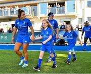 17 August 2019; Mascots, from left, Sadhbh McKane, age 9, and sister Caoimhe McKane, age 8, from Donore, Co. Meath, walk out with Leinster players Sene Naoupu and Lindsay Peat prior to the Women’s Interprovincial Rugby Championship match between Leinster and Connacht at Energia Park in Donnybrook, Dublin. Photo by Seb Daly/Sportsfile
