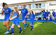 17 August 2019; Mascots, from left, Sadhbh McKane, age 9, Caoimhe McKane, age 8, and Tara McKane, age 5, from Donore, Co. Meath, walk out with Leinster players Sene Naoupu, Lindsay Peat and Linda Djougang prior to the Women’s Interprovincial Rugby Championship match between Leinster and Connacht at Energia Park in Donnybrook, Dublin. Photo by Seb Daly/Sportsfile