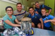 19 August 2019; Carla O'Connor aged 10, from Carrick on Suir, Co Tipperary, with, Tipperary players, from left, Séamus Callanan, Barry Heffernan, Jerome Cahill, Tipperary manager Liam Sheedy, and the Liam MacCarthy cup on a visit by the Tipperary All-Ireland hurling champions to Children's Health Ireland at Crumlin in Dublin.  Photo by Sam Barnes/Sportsfile