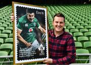 28 August 2019; Two of the great iconic figures of Irish Rugby, head coach Joe Schmidt and out-half Jonathan Sexton, were revealed today as the images chosen to celebrate the sport on the eve of Ireland's date with destiny in Japan. Sportsfile photographer, Ramsey Cardy, is photographed with a large copy of the €1 Sexton stamp, at the unveiling of the two An Post Irish Rugby Stamp in the IRFU Suite, Aviva Stadium in Dublin. Photo by Ray McManus/Sportsfile