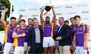 31 August 2019; Kilmacud Crokes captain Karl Dias lifts the cup alongside Conor Hayes, Londis Sales Director, right, and Pat Horgan, Chairman of Kilmacud Crokes Football, after beating An Ríocht, Co Down, in the final of the Londis Senior All-Ireland Football 7s at Kilmacud Crokes GAA Club in Stillorgan, Co Dublin. Photo by Piaras Ó Mídheach/Sportsfile