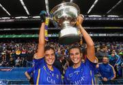 15 September 2019; Sisters Anna Rose Kennedy, left, and Caitlín Kennedy of Tipperary celebrate with the Mary Quinn Memorial Cup following the TG4 All-Ireland Ladies Football Intermediate Championship Final match between Meath and Tipperary at Croke Park in Dublin. Photo by Stephen McCarthy/Sportsfile