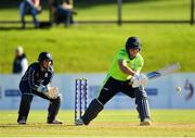 17 September 2019; Gary Wilson of Ireland plays a shot, watched on by Matthew Cross of Scotland, during the T20 International Tri Series match between Ireland and Scotland at Malahide Cricket Club in Dublin. Photo by Seb Daly/Sportsfile