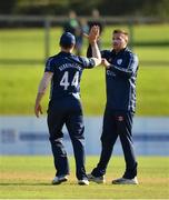 17 September 2019; Mark Watt of Scotland, right, is congratulated by team-mate Richie Berrington after trapping Lorcan Tucker of Ireland lbw during the T20 International Tri Series match between Ireland and Scotland at Malahide Cricket Club in Dublin. Photo by Seb Daly/Sportsfile