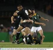 8 November 2003; Jerry Collins, New Zealand, in action against Danie Rossouw, South Africa. 2003 Rugby World Cup, Quarter Final, New Zealand v South Africa, Telstra Dome, Melbourne, Victoria, Australia. Picture credit; Brendan Moran / SPORTSFILE *EDI*