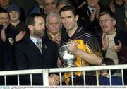 16 November 2003; Ulster captain Paul McGrane receives the cup from Sean Kelly, President of the GAA. M Donnelly Interprovincial Senior Football Final, Connacht v Ulster, Brewster Park, Enniskillen, Co. Fermanagh. Picture credit; Damien Eagers / SPORTSFILE *EDI*