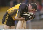 16 November 2003; Ulster's Steven McDonnell relieves the cramp of team-mate Tom Brewster. M Donnelly Interprovincial Senior Football Final, Connacht v Ulster, Brewster Park, Enniskillen, Co. Fermanagh. Picture credit; Damien Eagers / SPORTSFILE *EDI*