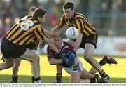 23 November 2003; Lar Wall, Arles-Kilcruise, is tackled by Round Towers Karl O'Dwyer, left, and Damien Broughall. AIB Leinster Club Football Championship Semi-Final, Arles-Kilcruise v Round Towers, Dr. Cullen Park, Carlow. Picture credit; Matt Browne / SPORTSFILE *EDI*