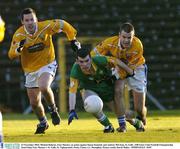 23 November 2003; Michael Doherty, Four Masters, in action against Simon Kennedy and Andrew McClean, St. Galls. AIB Ulster Club Football Championship Semi-Final, Four Masters v St. Galls, St. Tighearnach's Park, Clones, Co. Monaghan. Picture credit; David Maher / SPORTSFILE *EDI*