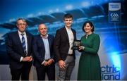 28 September 2019; Pictured is the Electric Ireland Minor Hurling All Star winner Cian Galvin of Clare at the 2019 Electric Ireland Minor Star Awards alongside, from left, Munster Council chairman Liam Lenihan, Derek McGrath and Executive Director of ESB Marguerite Sayers. The Hurling Team of the Year was selected by an expert panel of GAA legends including Alan Kerins, Derek McGrath, Karl Lacey and Tomás Quinn. The Electric Ireland GAA Minor Star Awards create a major moment for Minor players, showcasing the outstanding achievements of individual performers throughout the Championship season. The awards also recognise the effort of those who support them day in and day out, from their coaches to parents, clubs and communities. #GAAThisIsMajor Photo by David Fitzgerald/Sportsfile