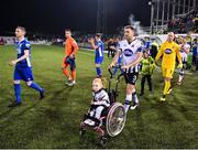 25 October 2019; Brian Gartland of Dundalk and supporter Zoe Murphy lead their side out prior to the SSE Airtricity League Premier Division match between Dundalk and St Patrick's Athletic at Oriel Park in Dundalk, Co Louth. Photo by Seb Daly/Sportsfile