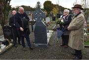 21 November 2019; Uachtarán Cumann Lúthchleas Gael John Horan unveils the headstone of Patrick O'Dowd with family members of the deceased during the unveiling of headstones on the graves of Jerome O’Leary, 10, Michael Feery, 40, and Patrick O’Dowd, 57, who are among the 14 people killed at Croke Park on this day 99 years ago on what became known as Bloody Sunday. These unveilings complete the list of seven Bloody Sunday victims who until recently had all been buried in unmarked graves at different locations at Glasnevin Cemetery in Dublin. Photo by Matt Browne/Sportsfile