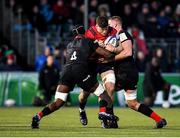 14 December 2019; Jack O’Donoghue of Munster is tackled by Joel Kpoku, left, and George Kruis of Saracens during the Heineken Champions Cup Pool 4 Round 4 match between Saracens and Munster at Allianz Park in Barnet, England. Photo by Seb Daly/Sportsfile