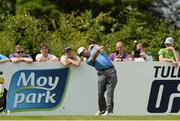 26 June 2013; Graeme McDowell watches his tee shot from the 4th tee box during the Irish Open Golf Championship 2013 Pro Am. Carton House, Maynooth, Co. Kildare. Picture credit: Matt Browne / SPORTSFILE