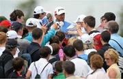 26 June 2013; Graeme McDowell signs autographs as he he makes his way to the 3rd tee during the Irish Open Golf Championship 2013 Pro Am. Carton House, Maynooth, Co. Kildare. Picture credit: David Maher / SPORTSFILE