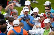 26 June 2013; Graeme McDowell signs autographs as he he makes his way to the 3rd tee during the Irish Open Golf Championship 2013 Pro Am. Carton House, Maynooth, Co. Kildare. Picture credit: David Maher / SPORTSFILE