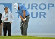 26 June 2013; Graeme McDowell pitches onto the 17th green blindfolded during the Irish Open Golf Championship 2013 Pro Am. Carton House, Maynooth, Co. Kildare. Picture credit: Matt Browne / SPORTSFILE