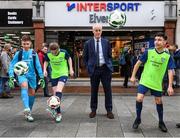 10 February 2020; The Football Association of Ireland are delighted to announce a new partnership with the leading Irish sports retailer INTERSPORT Elverys, as the new title sponsor of the FAI Summer Soccer Schools. Pictured at the announcement is Republic of Ireland manager Mick McCarthy with Larkin Community College students, from left, Adrian Lucaci, Isabelle Baker and Remis Galiceanu at INTERSPORT Elverys, Henry Street in Dublin. Photo by Stephen McCarthy/Sportsfile
