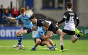 26 February 2020; Harry Farrell of Newbridge College in action against Larry Kirkham, right, and David Ryan of St Michael's College during the Bank of Ireland Leinster Schools Junior Cup Second Round match between St Michael’s College and Newbridge College at Energia Park in Dublin. Photo by Piaras Ó Mídheach/Sportsfile